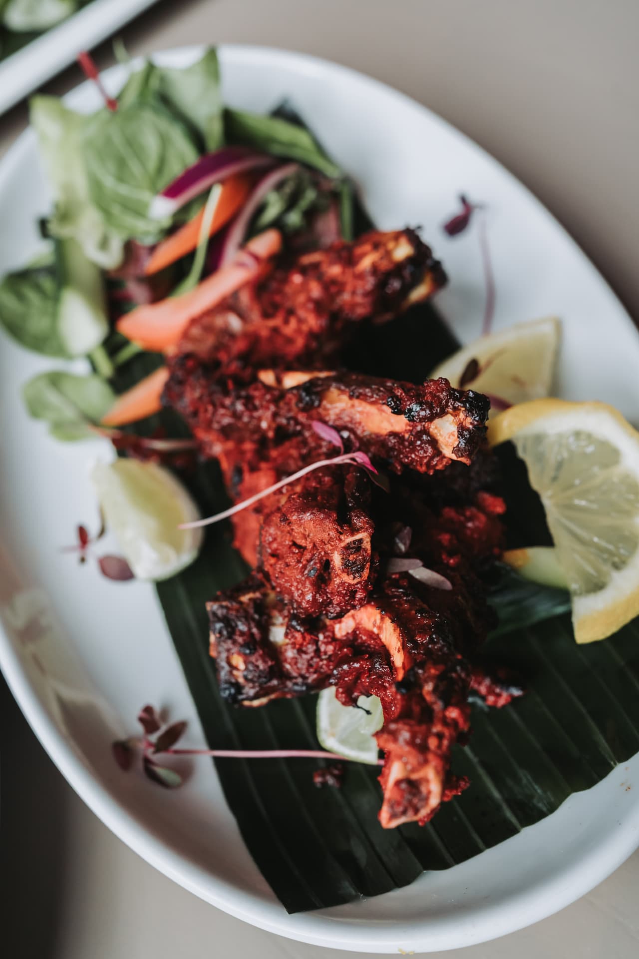 Charred tandoori lamb chops with fresh salad at Anaya